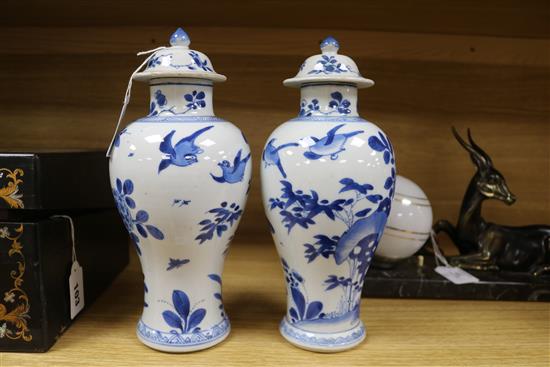 A pair of Chinese blue and white vases and covers, kangxi period Height 26cm